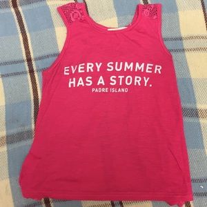 A Hot pink sleeve less top perfect in the  summer.